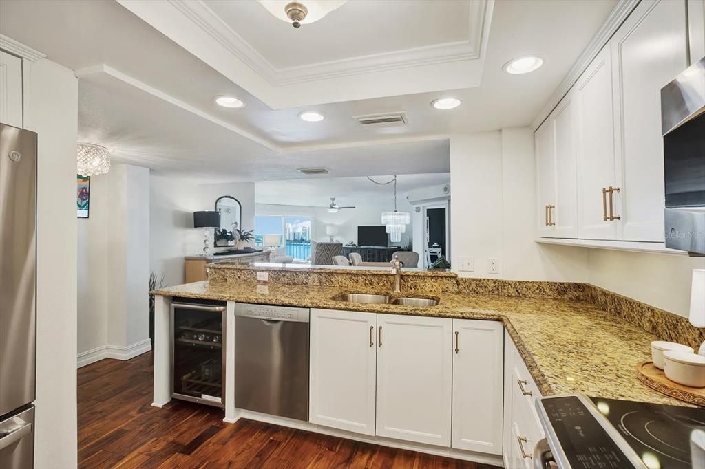 Timeless white shaker cabinets with brass handles.