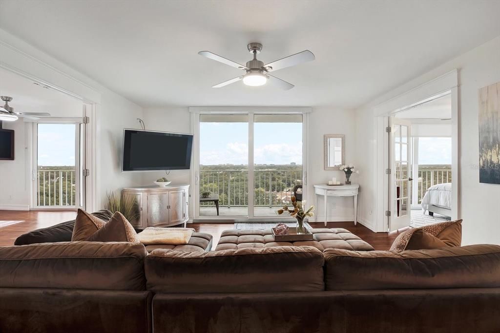 Second living room with wet bar and city views.