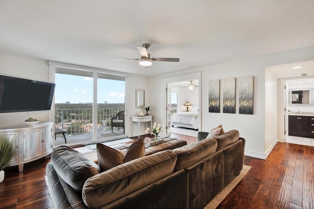 Second living room with wet bar and city views.