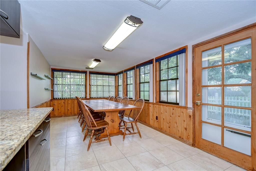 Huge dining space with panoramic views of the backyard!