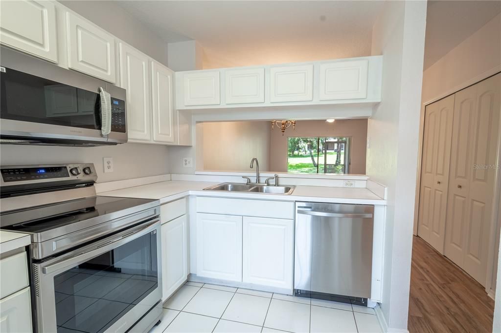 The kitchen has a convenient pass through to the dining and living rooms.