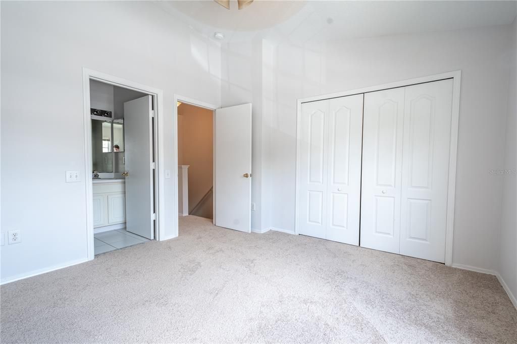 The 2nd bedroom features a built-in closet, carpet and an ensuite bath.