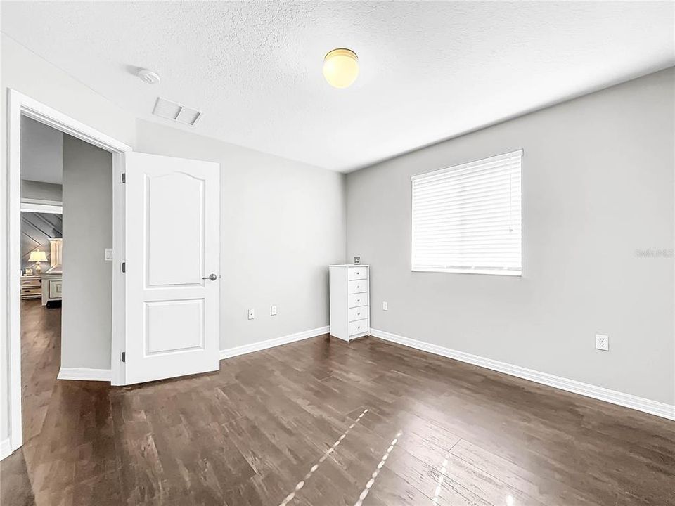 All bedrooms are spacious with new flooring.