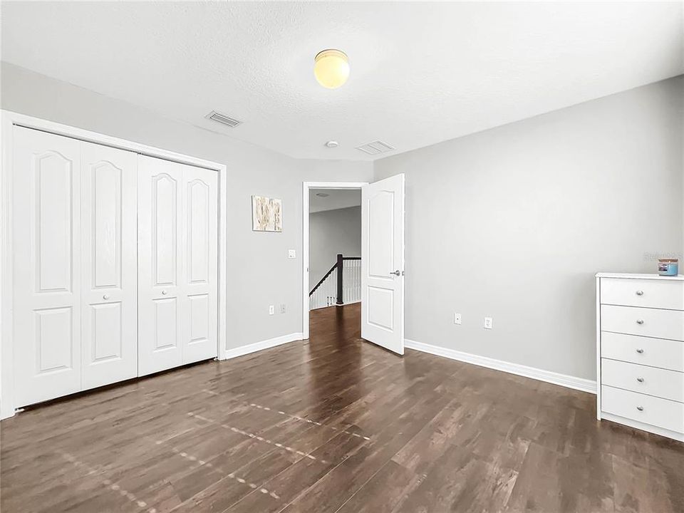 All bedrooms are spacious with new flooring.