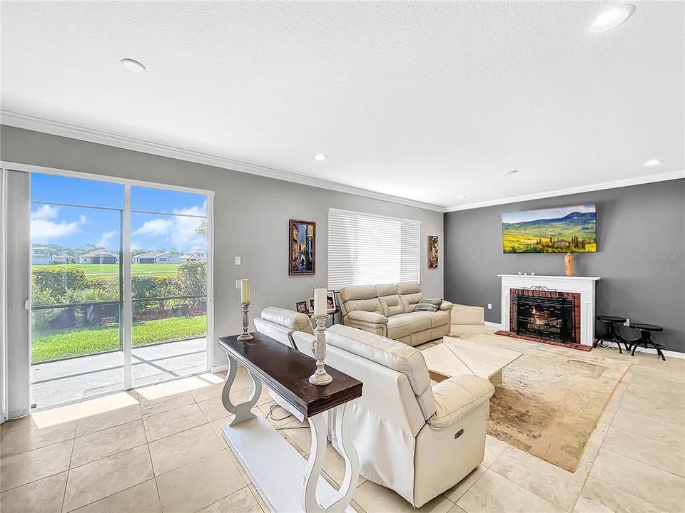 The large family room the view of the golf course and is open to the kitchen.