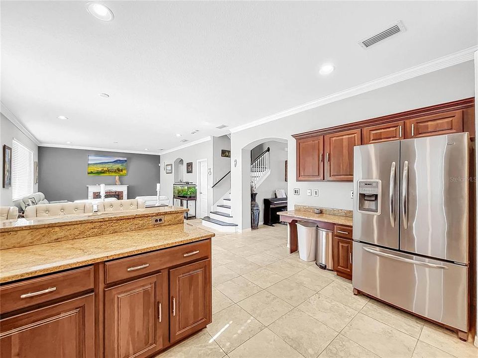 The large gourmet kitchen has plenty of counter space and cabinets.  A large pantry and opens up to the family room.  Perfect for entertaining.