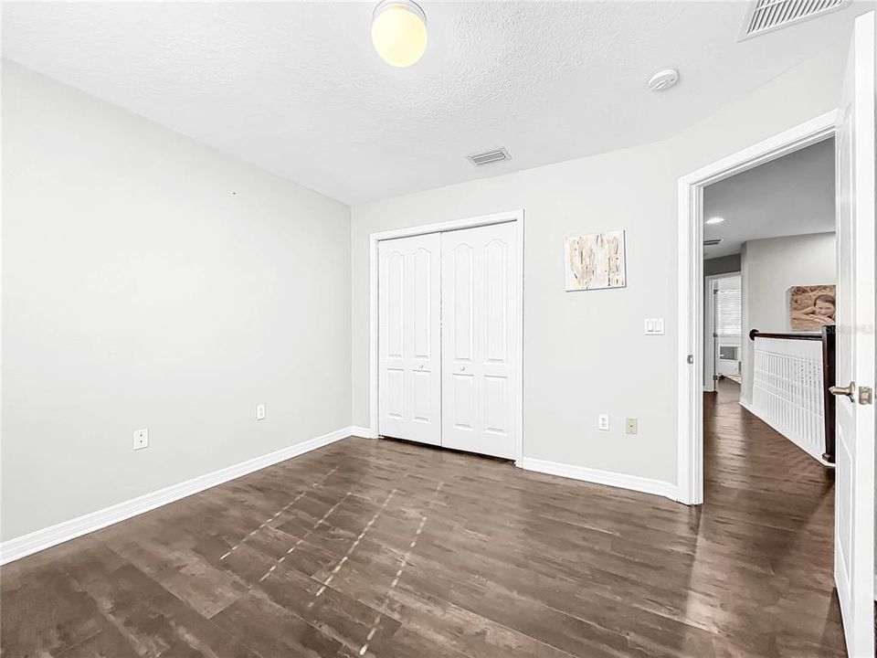 All bedrooms are spacious with new flooring.