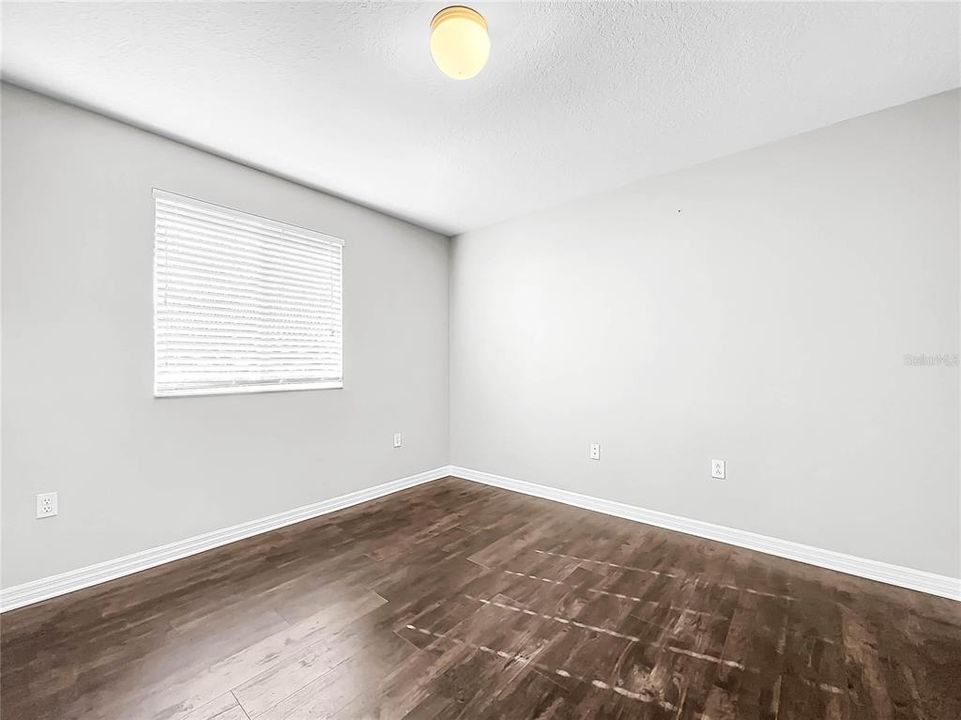 All bedrooms are spacious with new flooring.