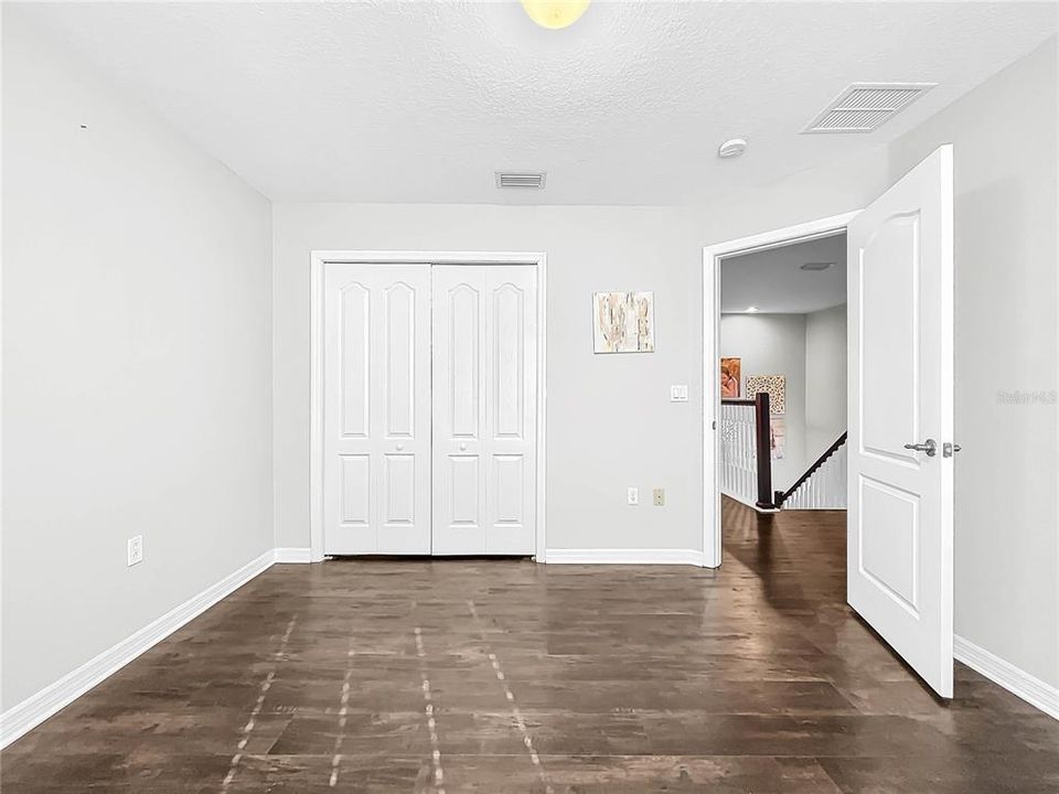 All bedrooms are spacious with new flooring.