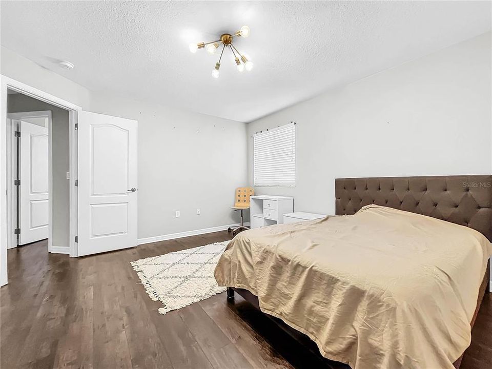 All bedrooms are spacious with new flooring.