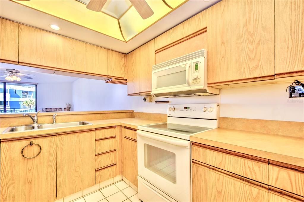 Kitchen with bar to Living area.