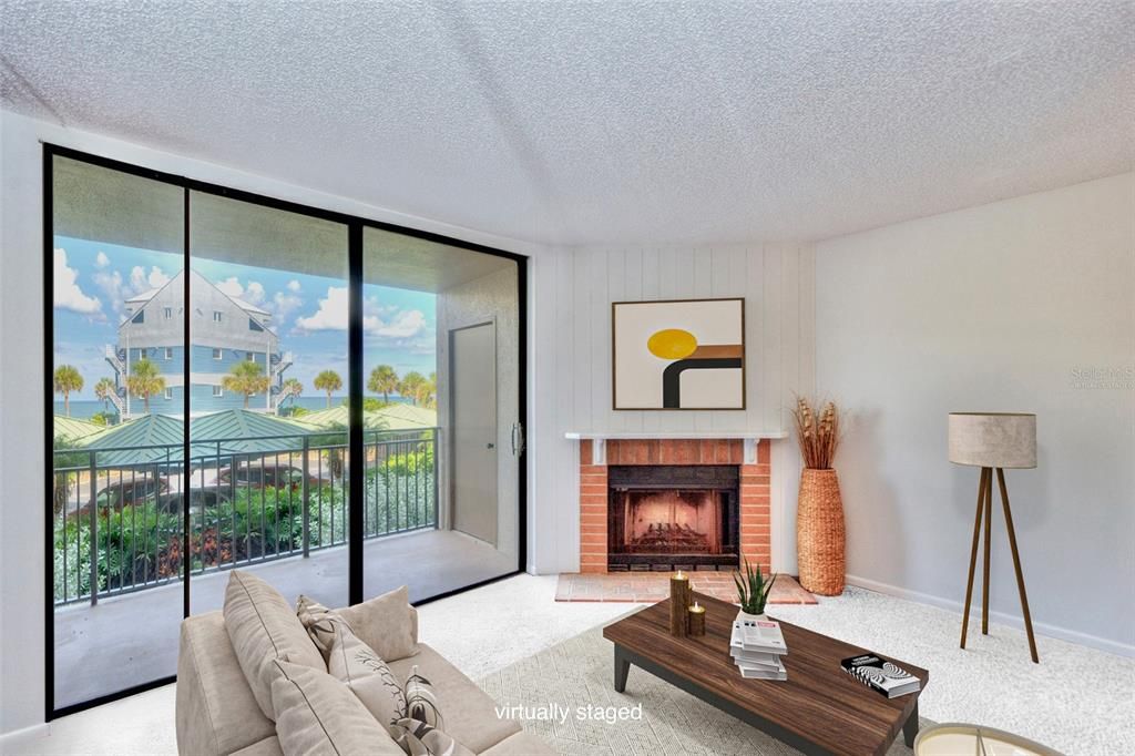 Virtually staged: Gulf views and a Wood burning Fireplace enhance the living area.