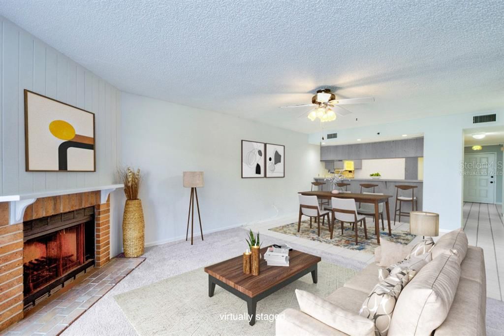 Virtually Staged Living / Dining Area with bar open to kitchen.