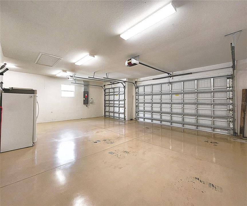 Inside utility room includes side by side washer and dryer