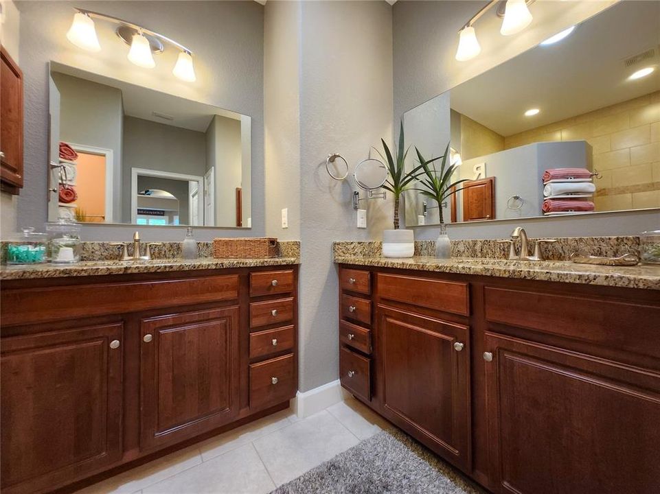 Master includes walk in shower, private water closet, dual medicine cabinets & vanities