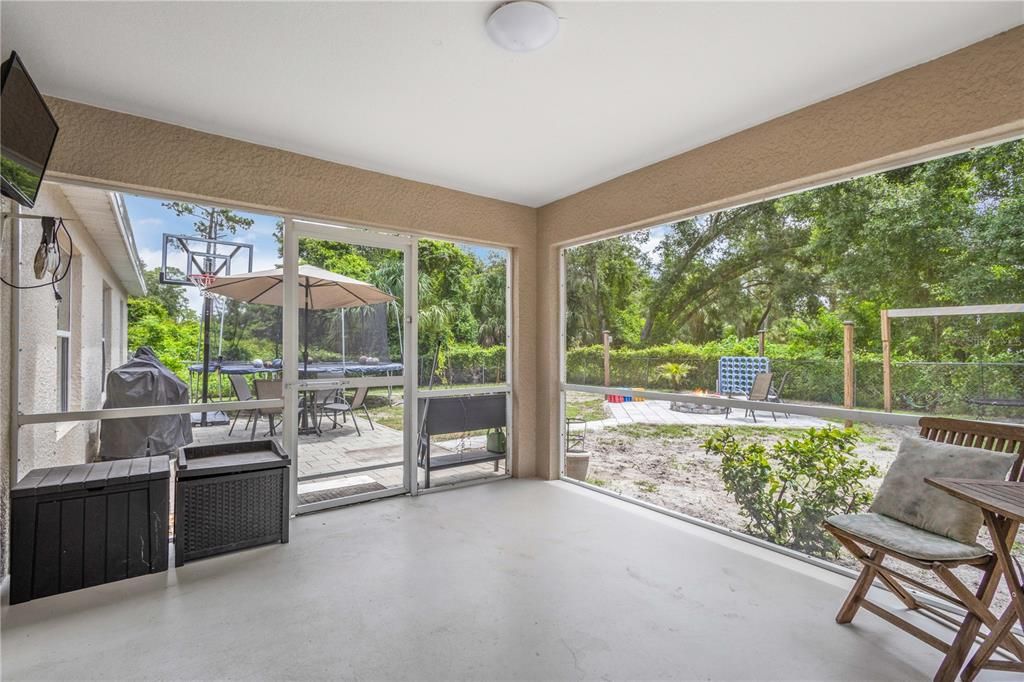 LANAI VIEW OVERLOOKING BRICK PAVER PATIO FOR OUTDOOR ENTERTAINING