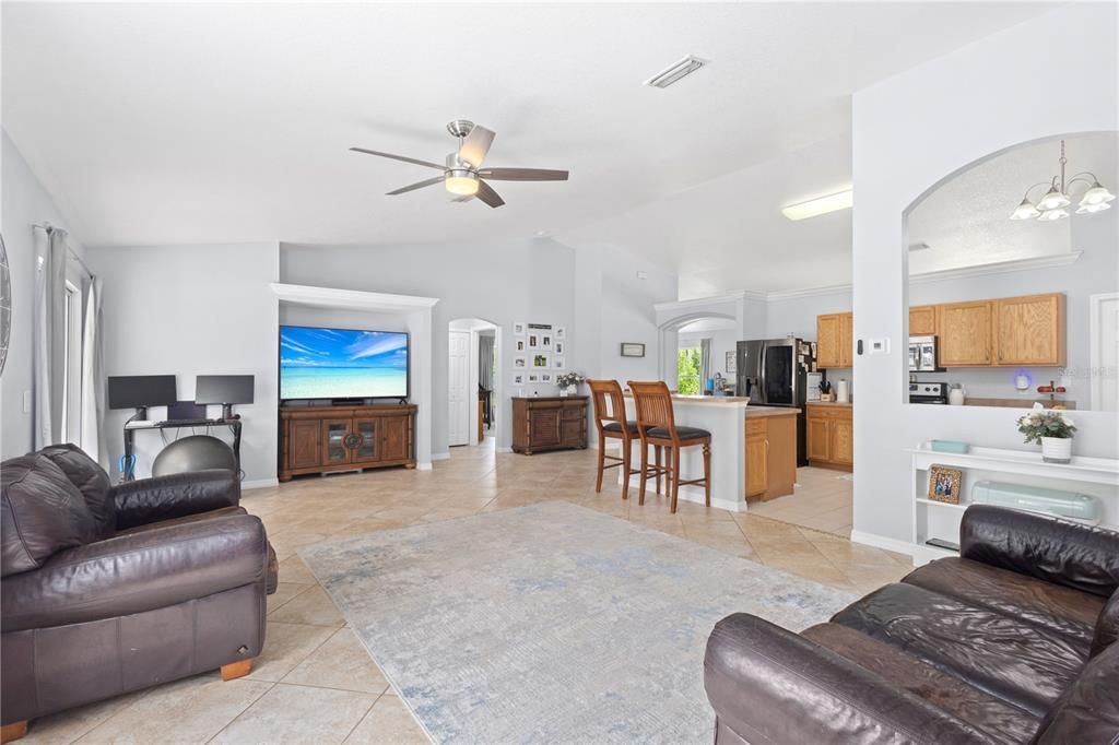 FAMILY ROOM OVERLOOKING KITCHEN,  LOTS OF TILE AND PLANT SHELVES