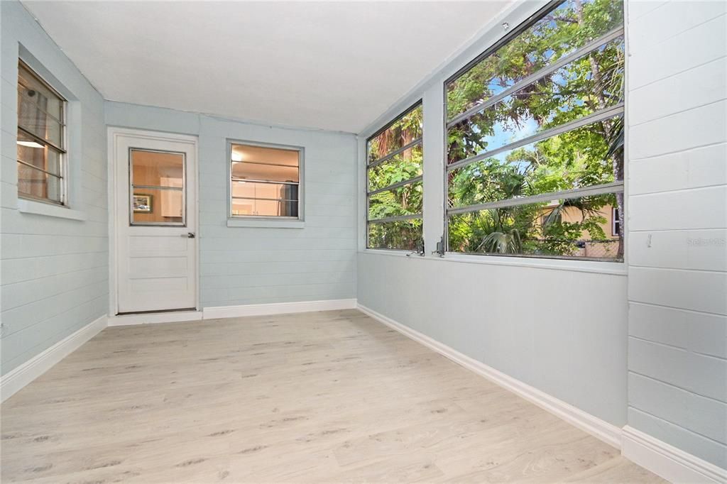 Enclosed Carport. Endless possibilities including playroom, mudroom, extra storage, office, etc.