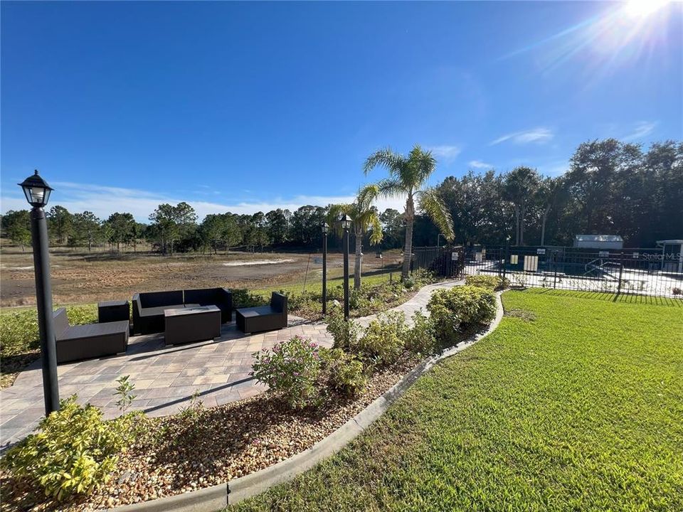 outdoor seating area leading to pool