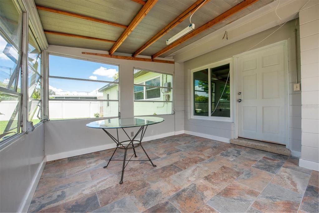 Spacious, enclosed back porch