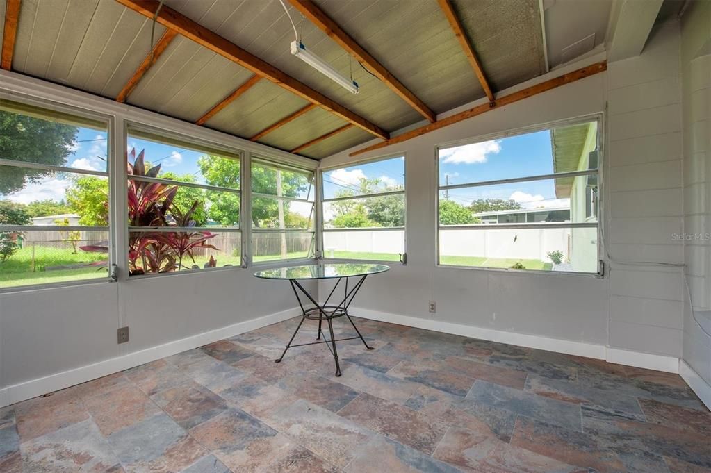 Spacious, enclosed back porch