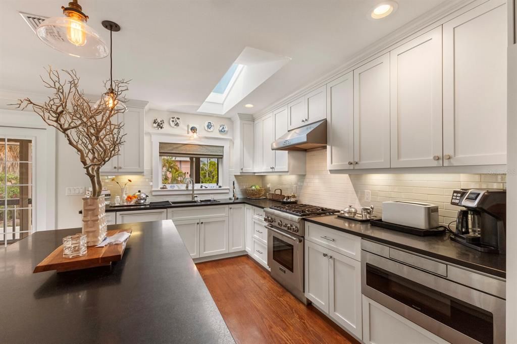 gas Thermador Stove and skylight in the kitchen