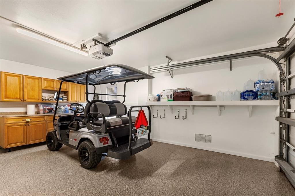 second garage - park golf cart or car, store beach toys, built in cabinets and shelves too