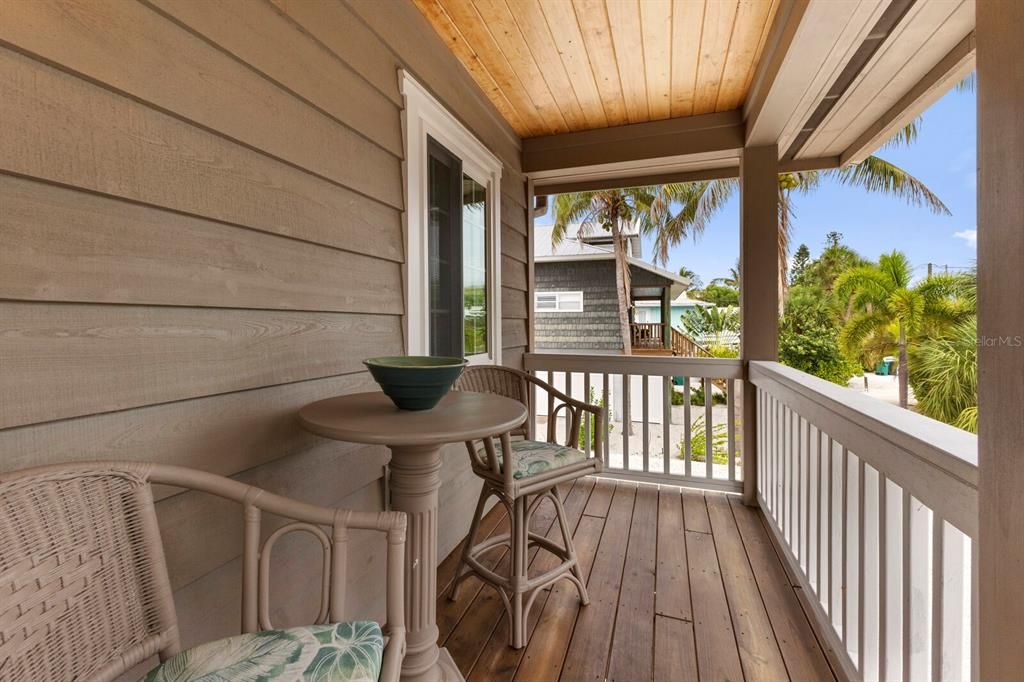 covered patio off the primary bedroom - glimpess of Tampa Bay