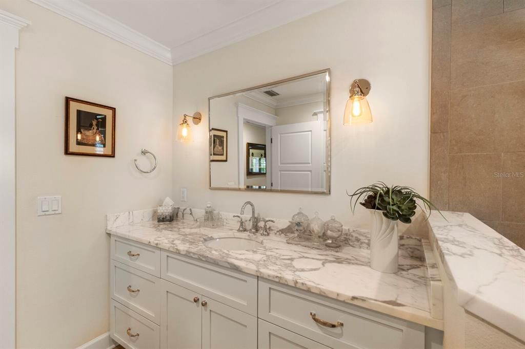 STUNNING marble counter tops in the primary bathroom - dual vanities too!