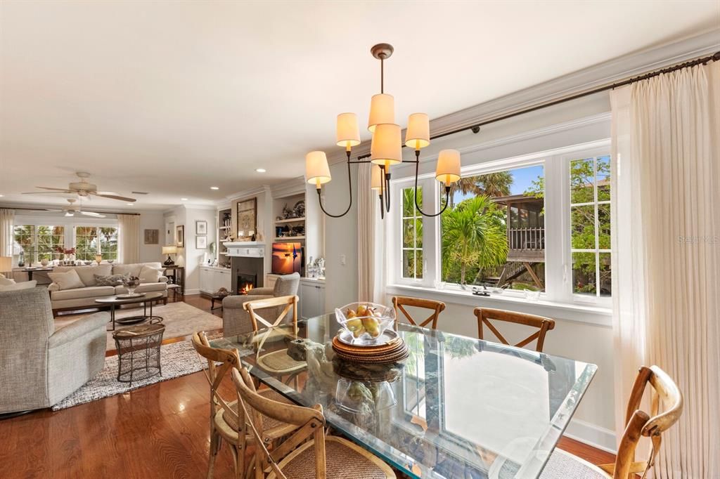 Impact windows allow lots of natural light in the dining room - french doors open up to the screened in back patio