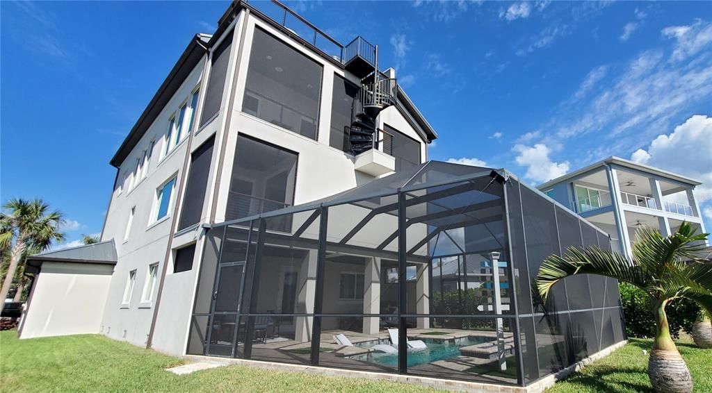 Screened Pool and Patio with Firepit and Spiral Stair to the 4th Floor