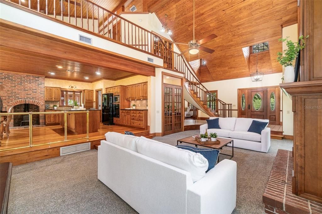 Great Room looking over into the Kitchen with the loft above