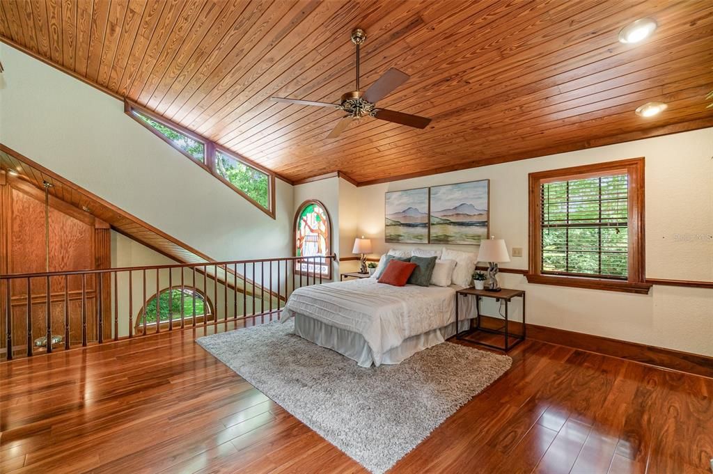 Bedroom II with the Stained Glass Window alongside the railing