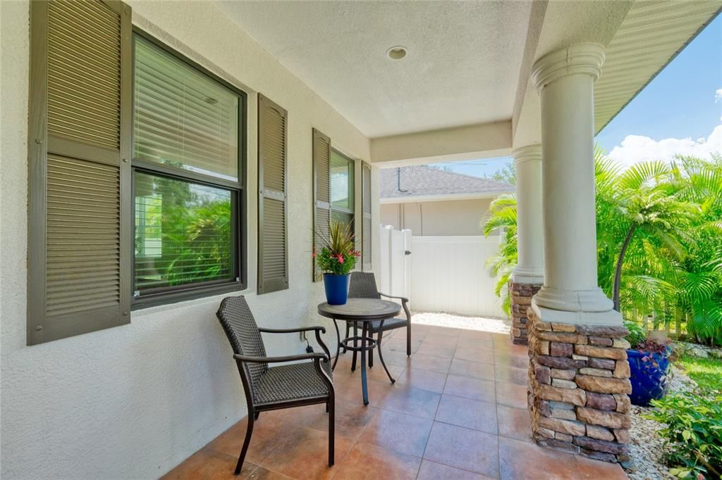 Enjoy a glass of wine under the shady front porch