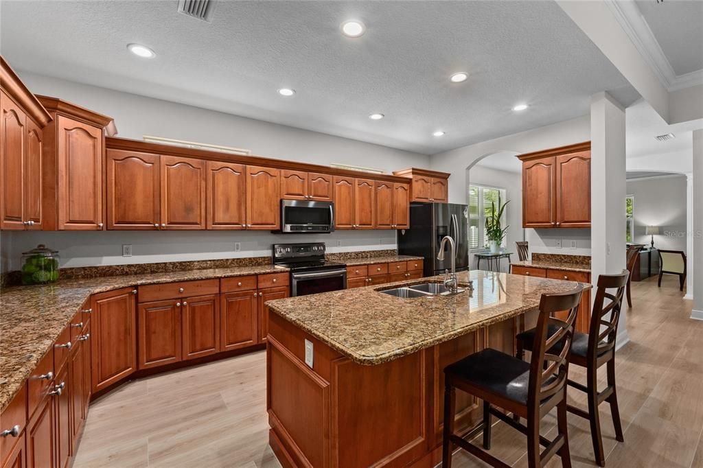 Large Island, Granite Countertops and Stainless Steel appliances