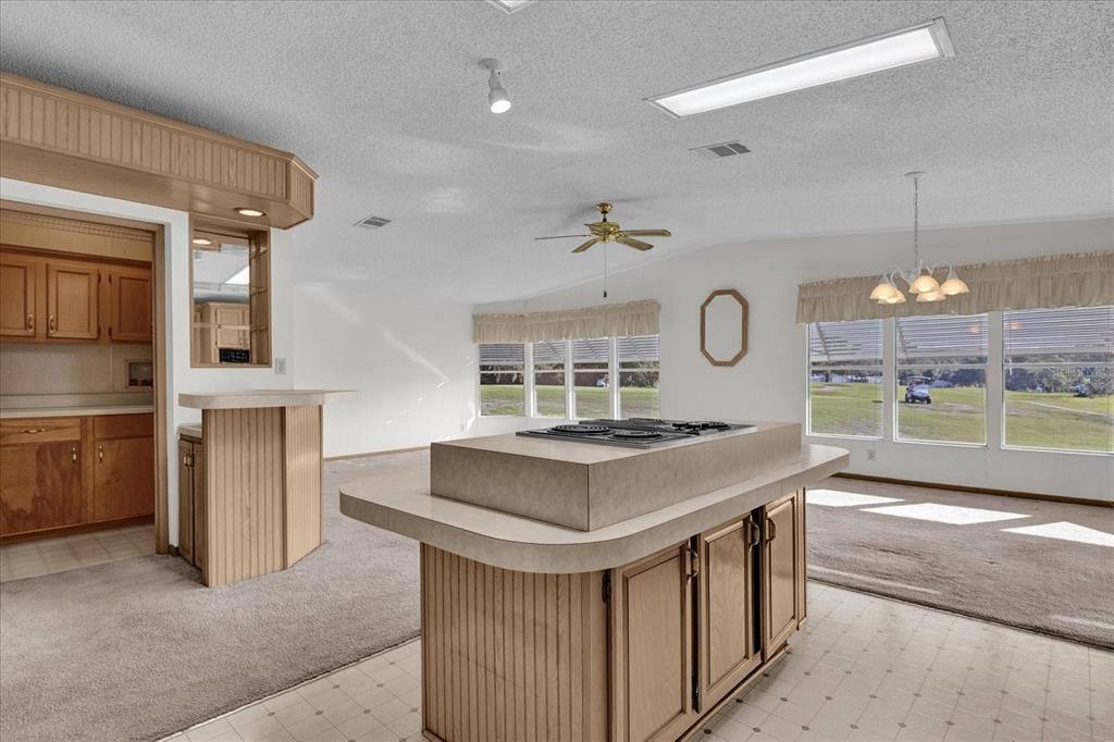 Kitchen looking into Family Room, Casual Dining Area with Golf ViewsBar and Pantry (Can also be Indoor Laundry Room)