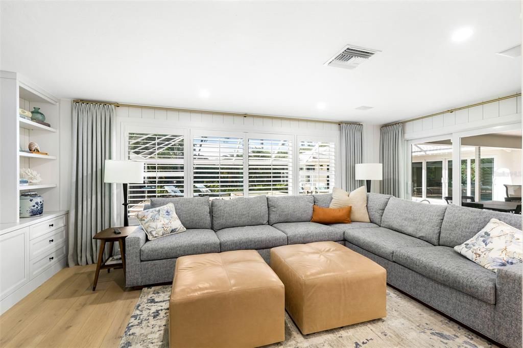 Family room overlooking outdoor living and pool area