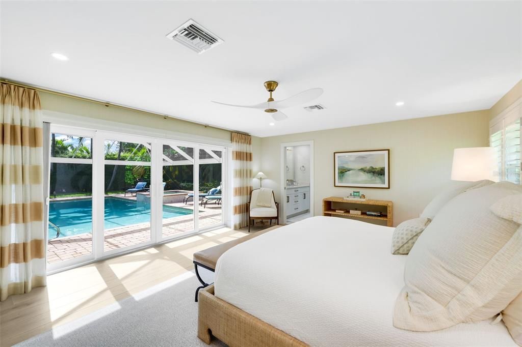 Primary bedroom overlooking pool