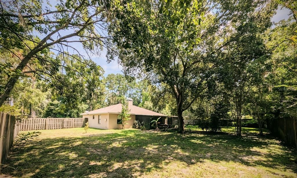 Large yard with mature trees