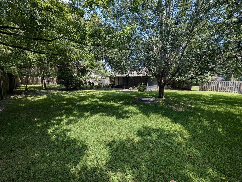 Large yard with mature trees