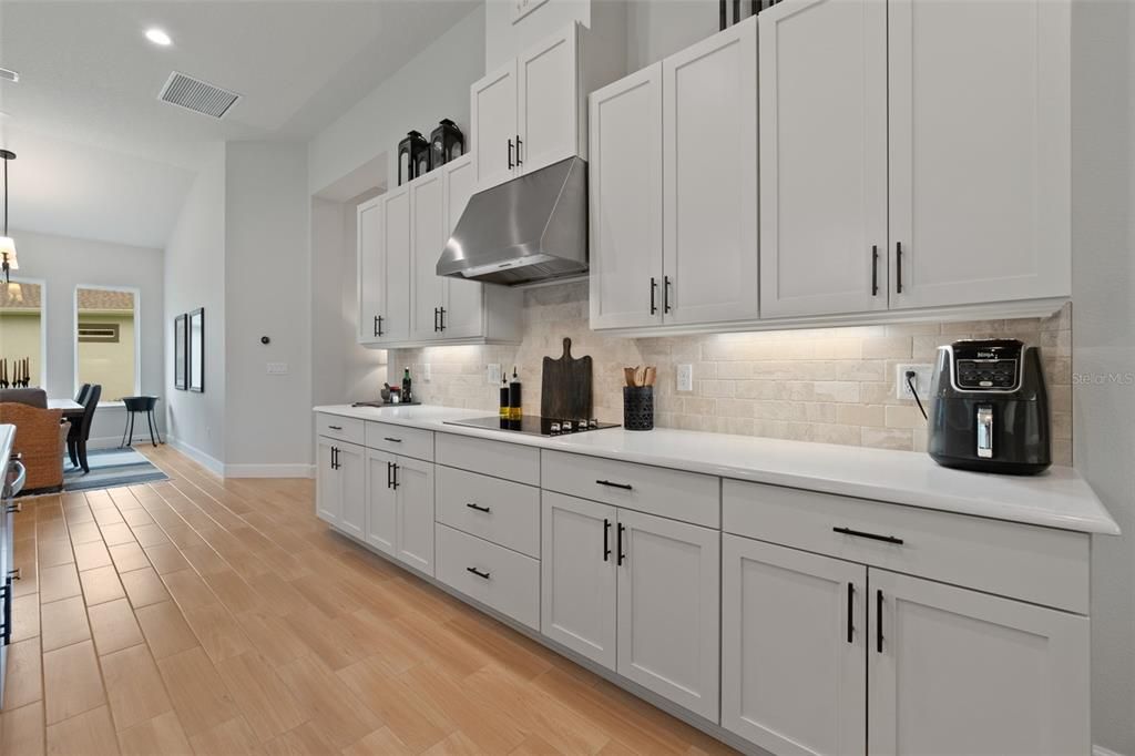 Quartz Countertops w/Travertine Tile Backsplash