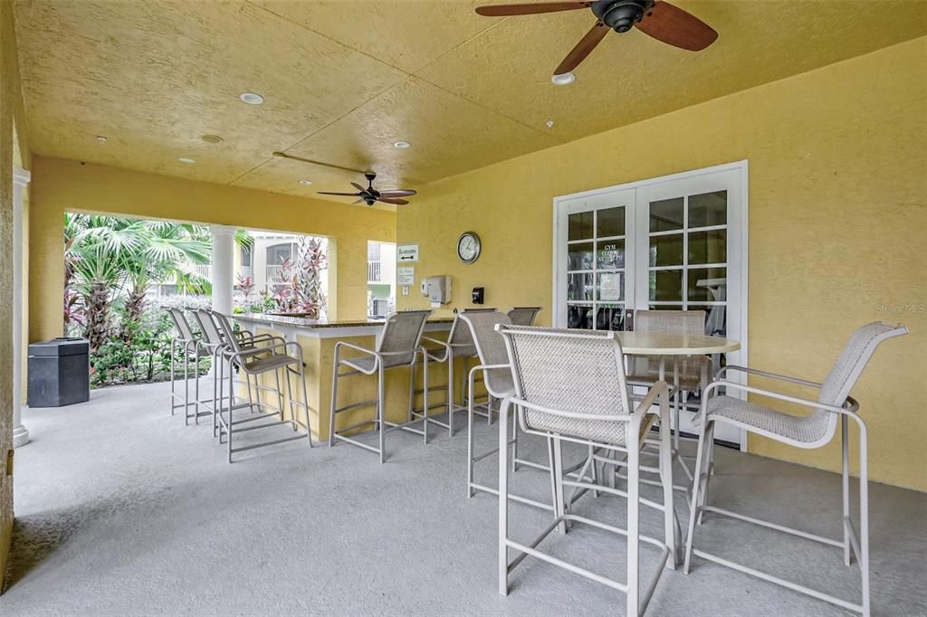 Rest area by the pool with outdoor kitchen