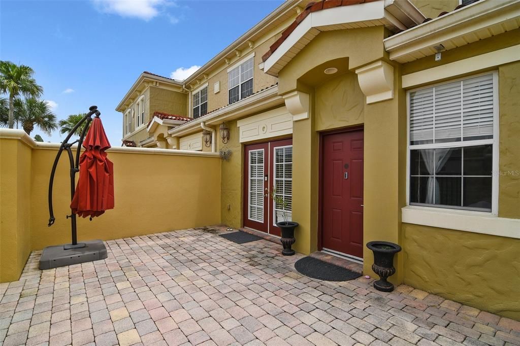 A courtyard entrance greets you as you step through the gate with space to enjoy the outdoors, grill or relax and unwind at the end of a long day!