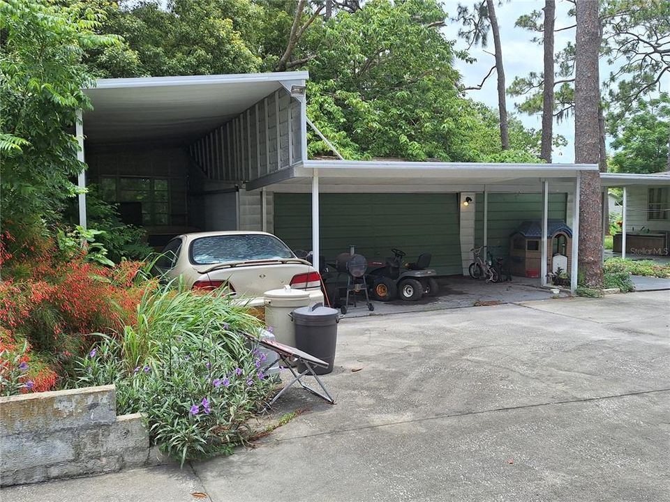 DETACHED 3 CAR GARAGE AND LONG COVERED CARPORT