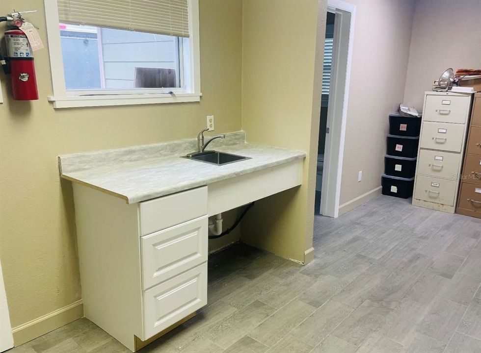 REAR BREAK ROOM AREA (SINK & MICROWAVE/COFFEE STATION