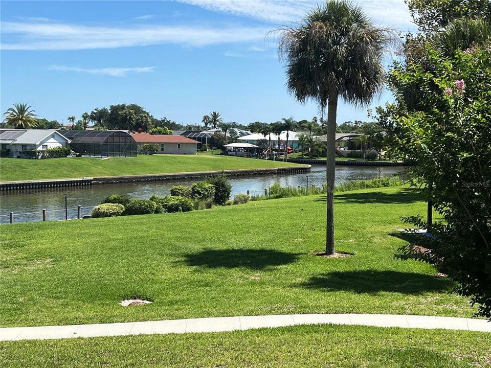 Serene Canal Views From This 2/2 Second Floor Condo