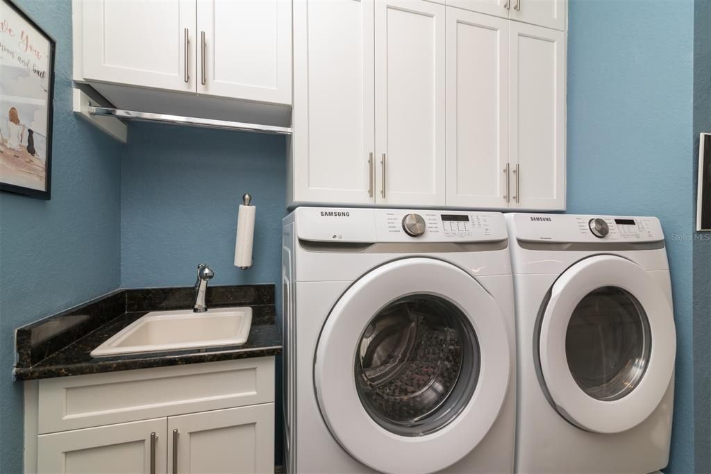 The handy utility sink in the "flex" room increases the usefulness of this space. The added cabinetry is a plus.