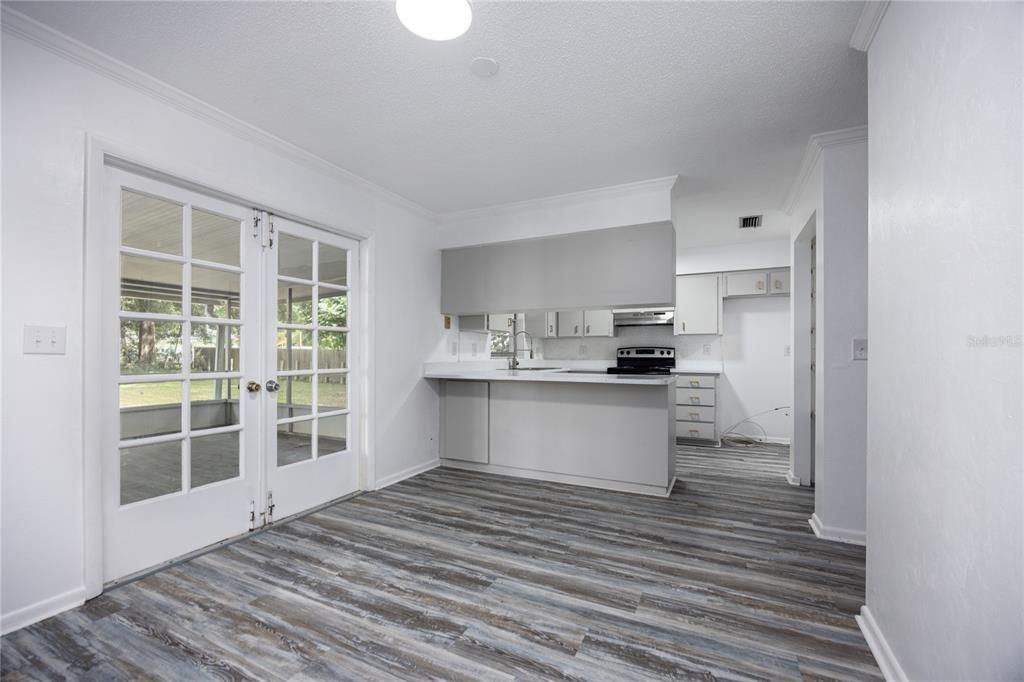 Dining room with french doors to screen room