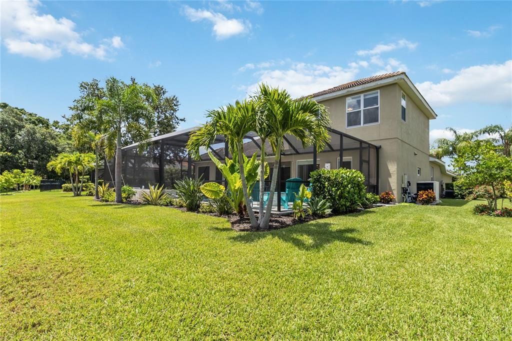 Scenic backyard oasis with meticulously landscaped gardens and plenty of open space for your kids and fur babies to run around, fencing is allowed in Greyhawk Landing.