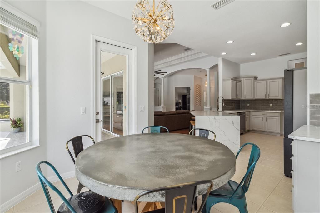 Sit under the elegant yet chic upgraded light fixtures while you enjoy a casual meal with your loved ones while also being able to flow directly out into the oversized lanai through one of the many private entrances.